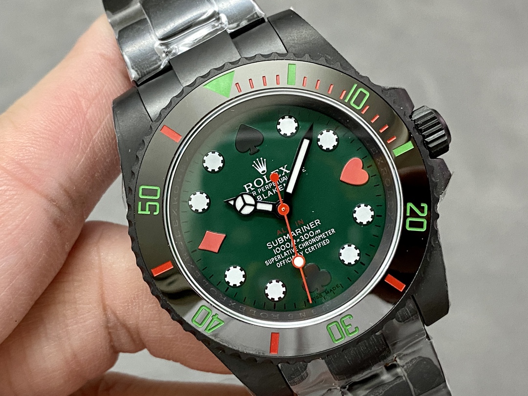 rolex super clone Submariner with green dial and poker symbols worn on wrist