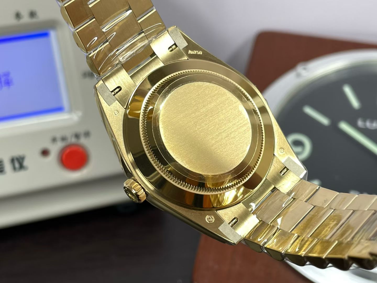 Gold Rolex Day-Date replica caseback view with polished and brushed finishing
