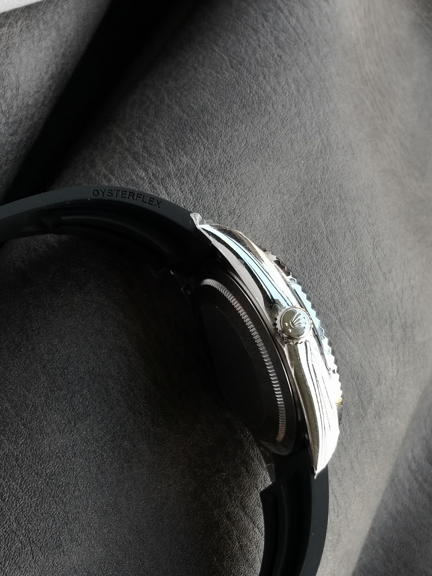 Side profile of replica Rolex Sky-Dweller showing Oysterflex band