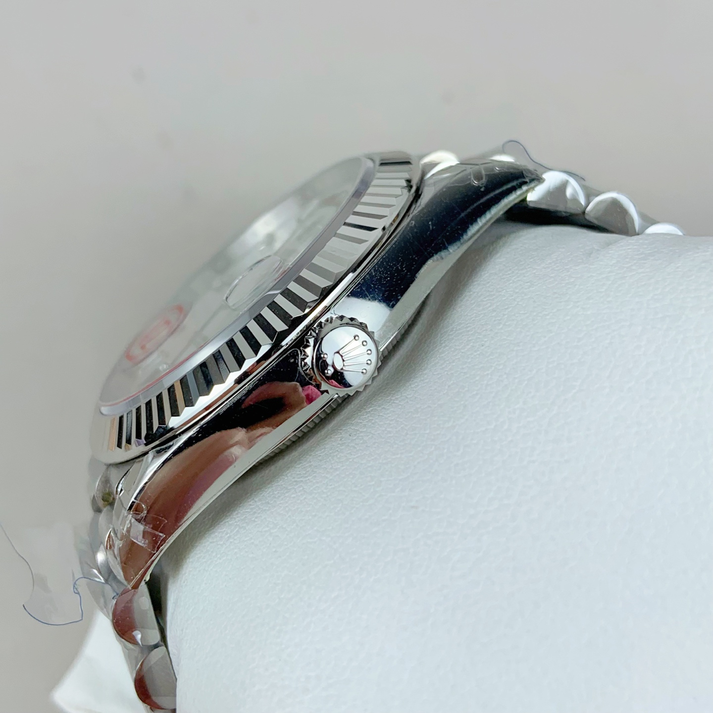 Rolex Day-Date side profile with fluted bezel and crown
