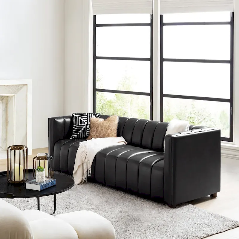 83-inch genuine leather curved sofa with a grooved backrest.