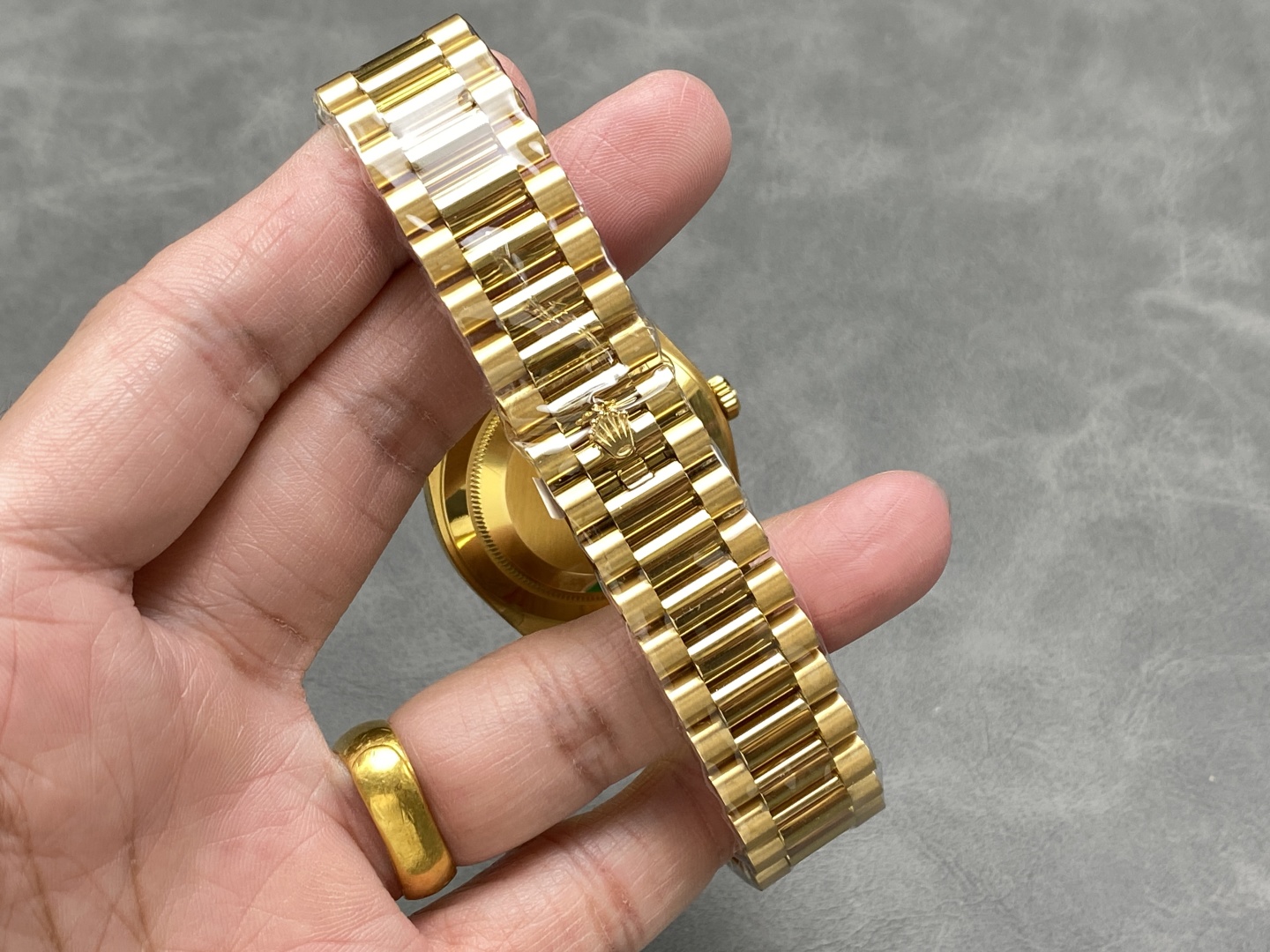 Gold Rolex Day-Date replica President bracelet and clasp with protective film and polished center links