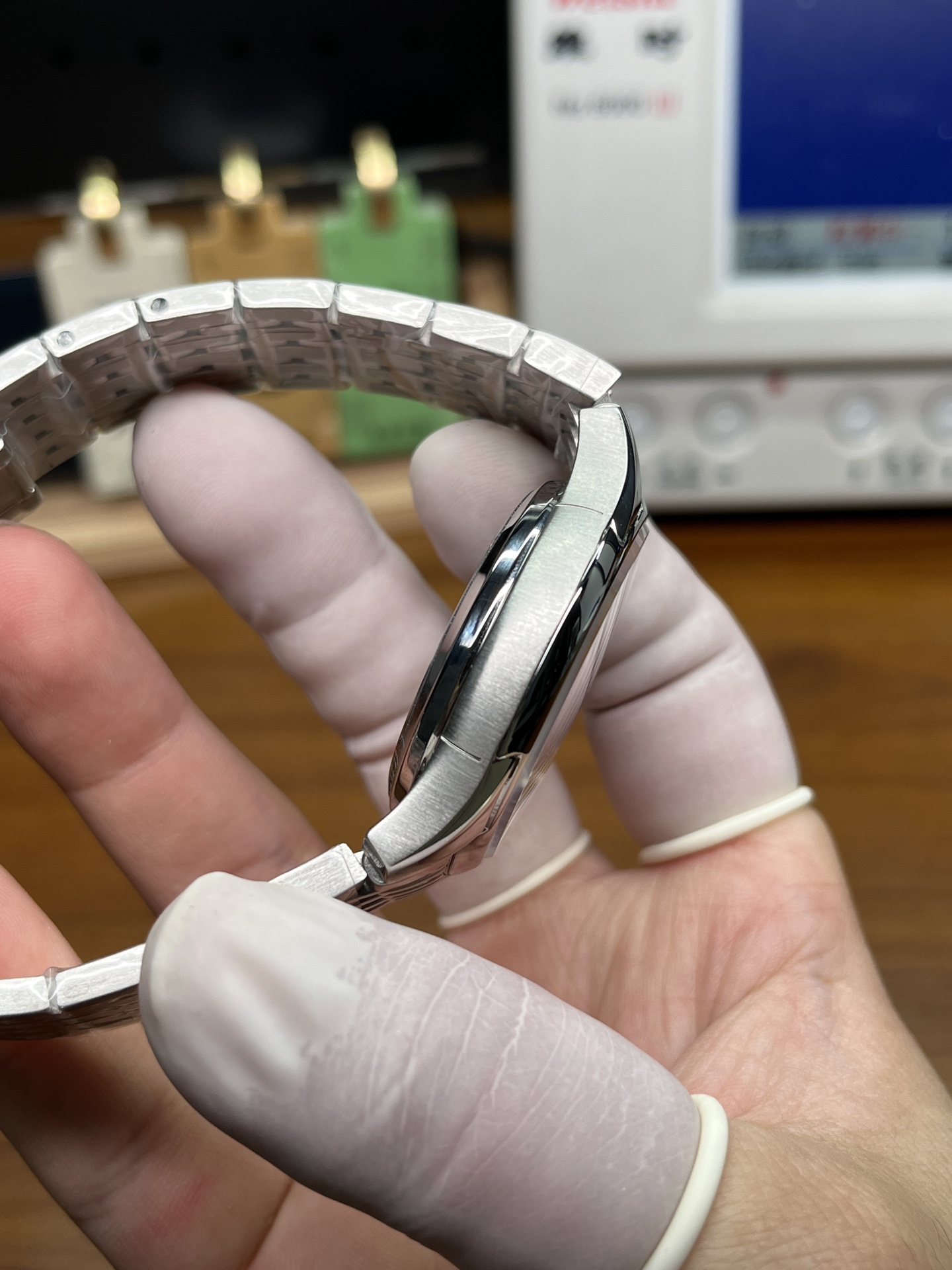 Omega replica case side profile with polished bezel and brushed case finishing