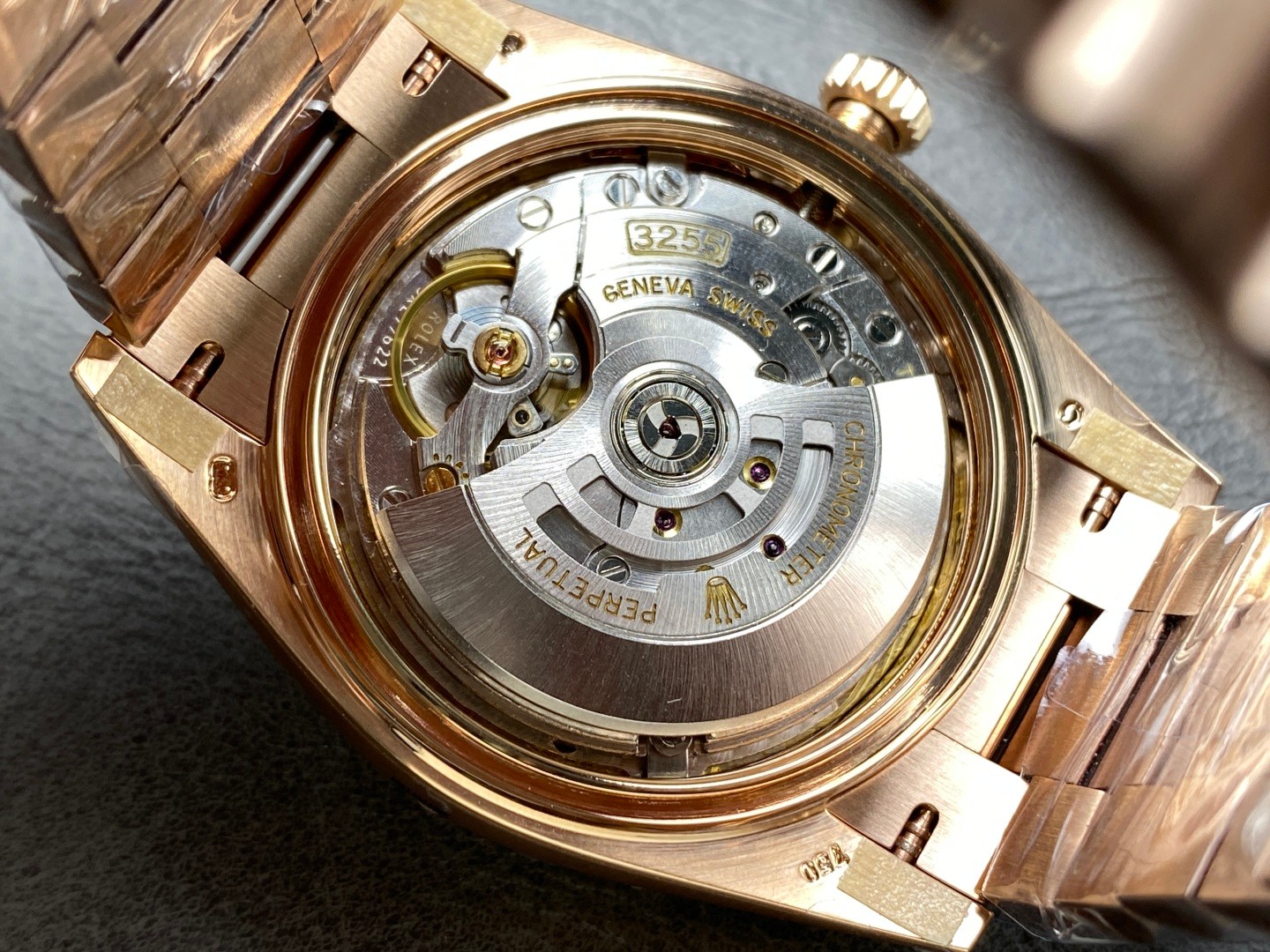 3255 clone movement visible through open Rolex Day-Date replica caseback