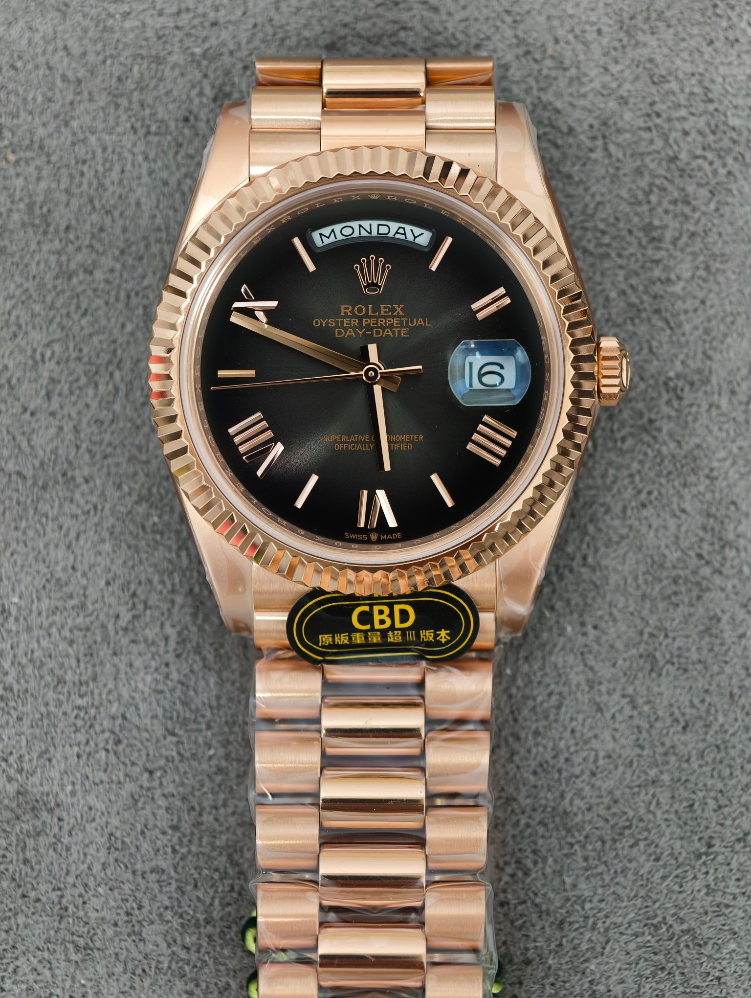 Front view of the rose gold Rolex Day-Date AAA+ ultra grade 3 replica watch with black dial showing day and date