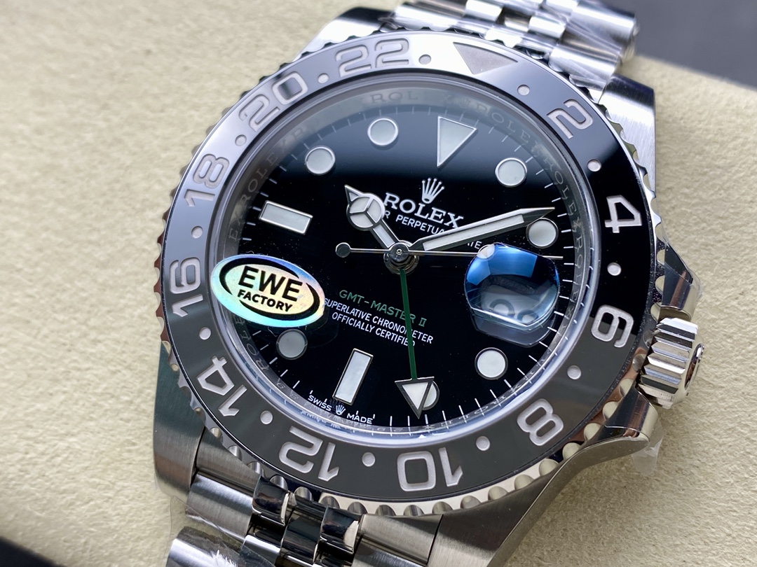 Close up of replica GMT-Master II black dial and green GMT hand