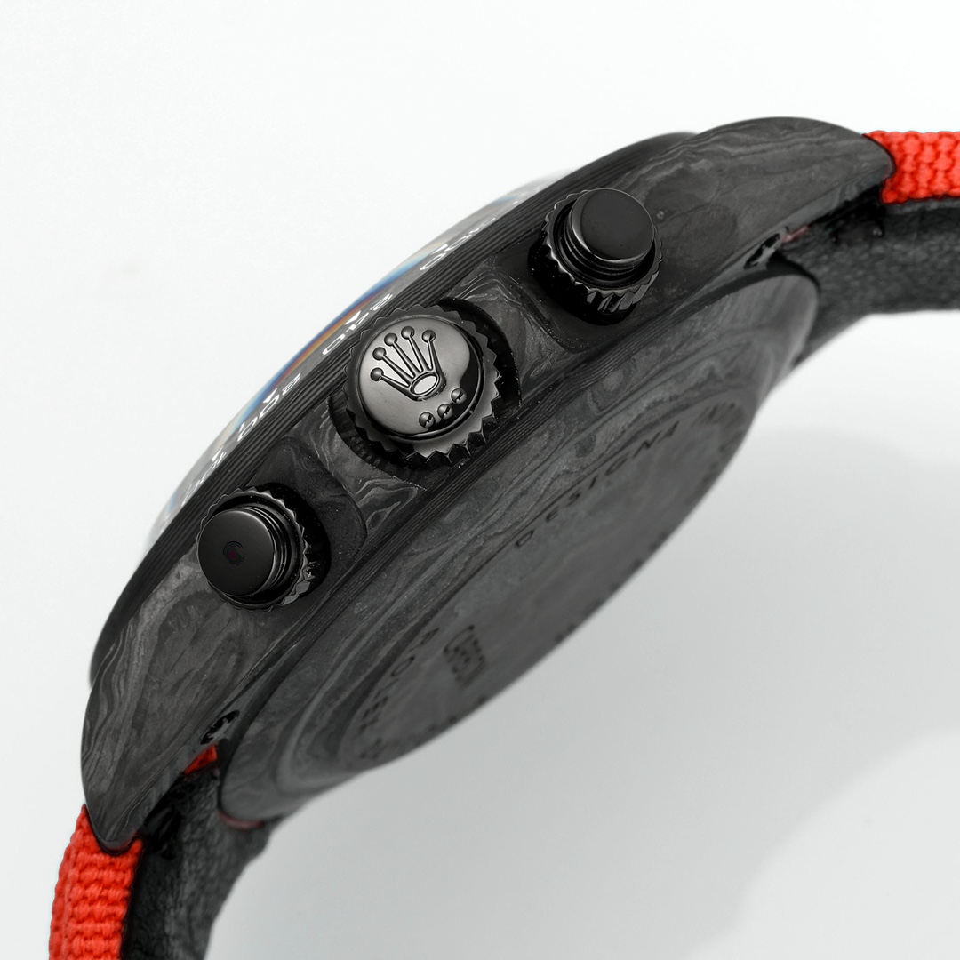 Angled side view of the carbon fiber Rolex Daytona replica showing chronograph pushers, crown, and red strap attachment