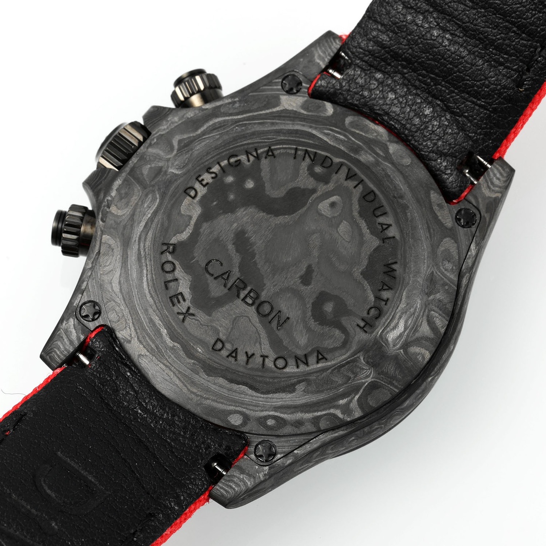 Back view of the carbon fiber caseback engraved with Rolex Carbon Daytona branding on the super clone watch with red stitched strap