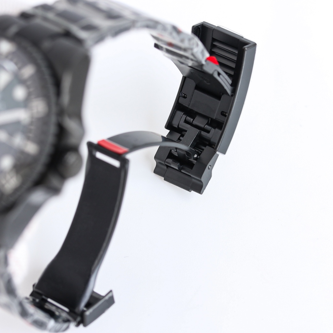 Close-up of the black DLC coated replica watch clasp mechanism and rubber strap