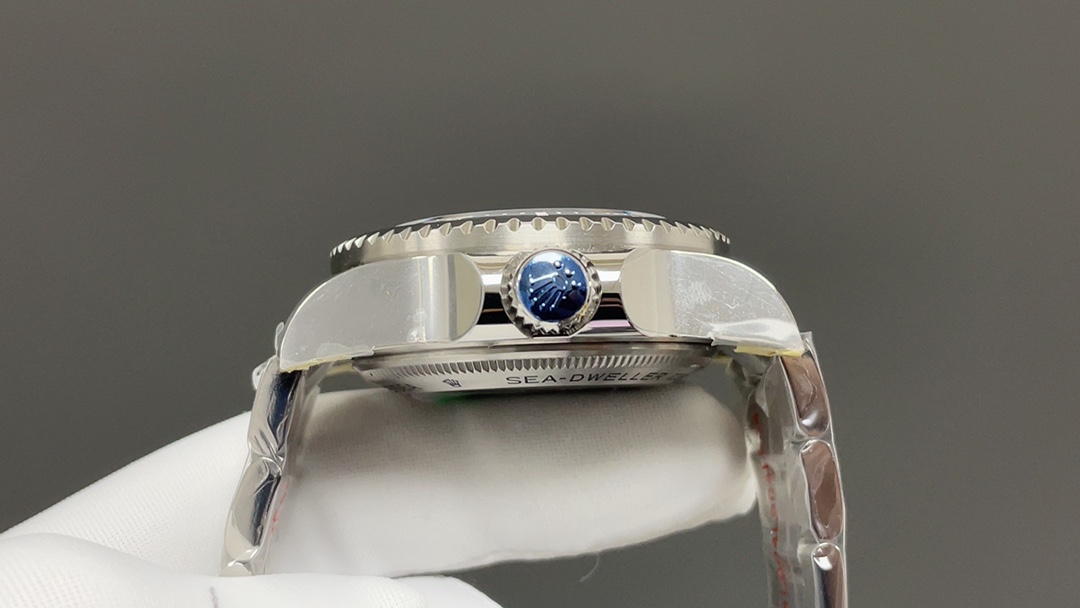Replica Rolex side profile with blue crown and polished case finishing