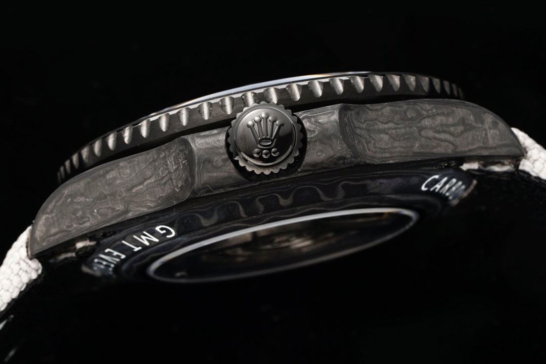 Carbon fiber case side profile with crown and engraved bezel
