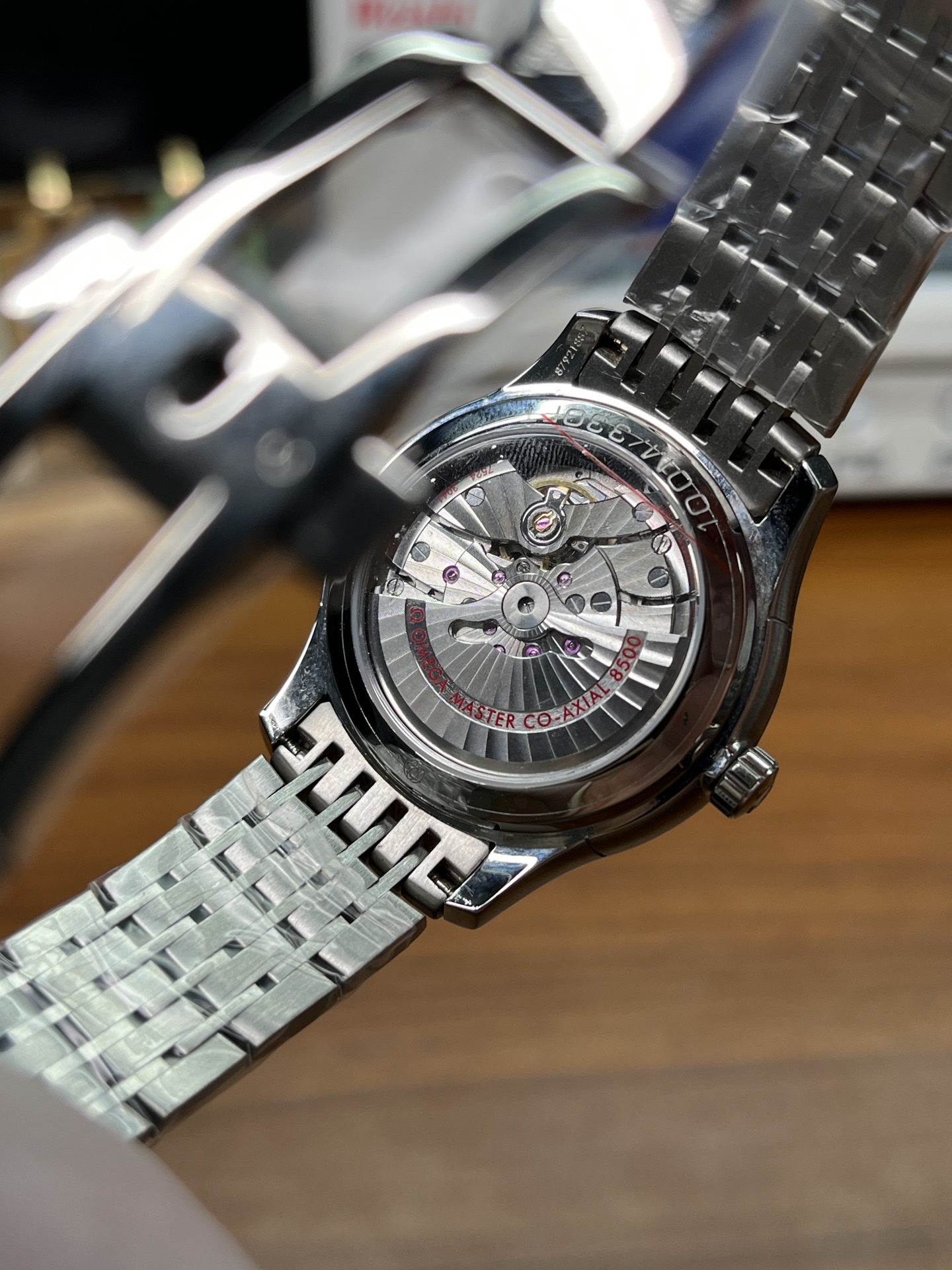 Omega 8500 clone movement visible through exhibition caseback