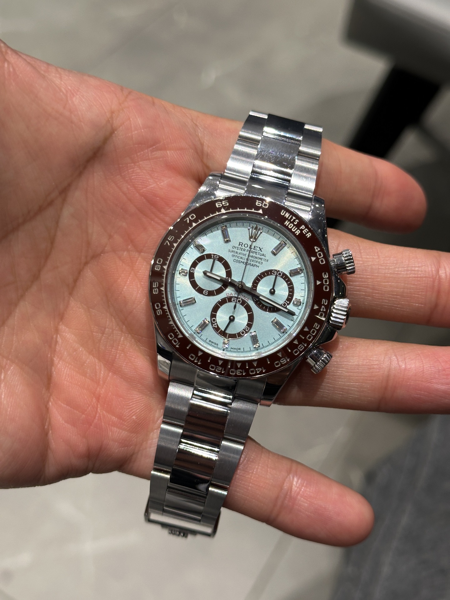 Ice blue chronograph watch close-up showing dial and bezel details