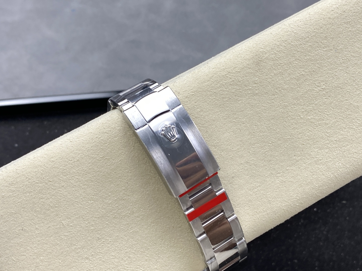 Rolex super clone bracelet clasp close-up with red protection tape