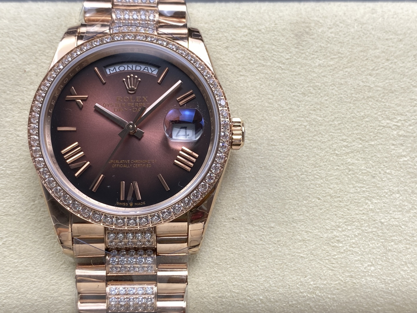 Rose gold Rolex Day-Date replica with diamond bezel, diamond bracelet, brown dial and Roman numerals