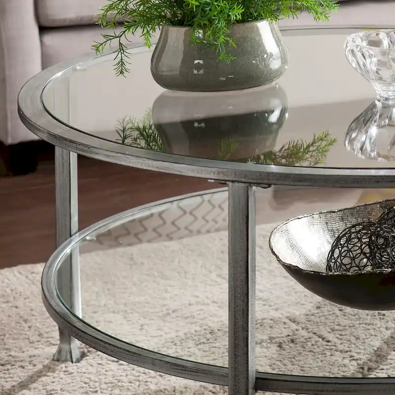 SEI Furniture Glenn Distressed Silver Round Coffee Table with Glass Top and Shelf