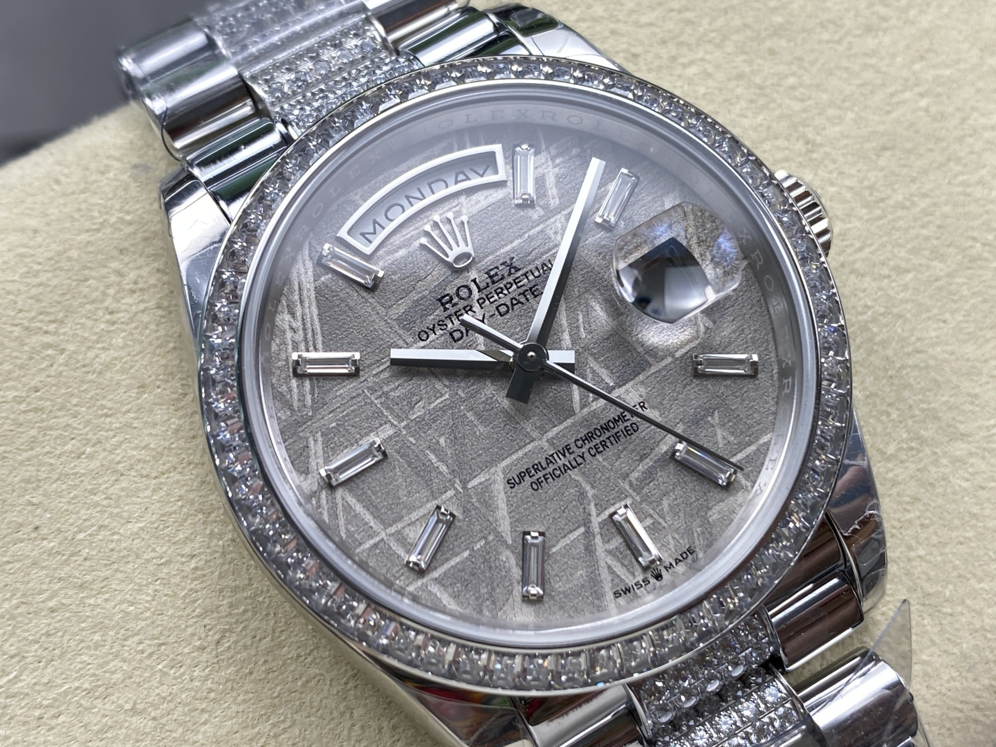 Silver dial with crystal markers and day-date complication