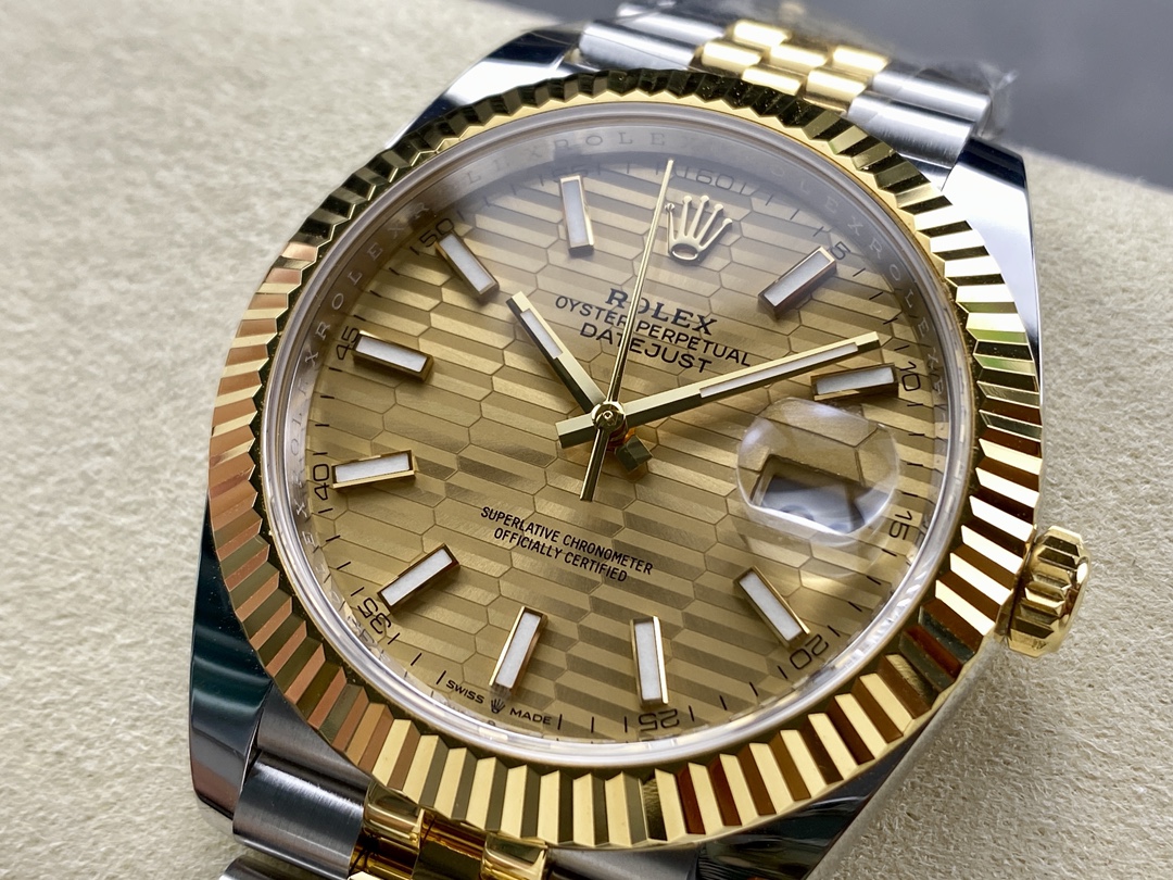 Close up of Datejust replica gold dial with fluted bezel and cyclops date window