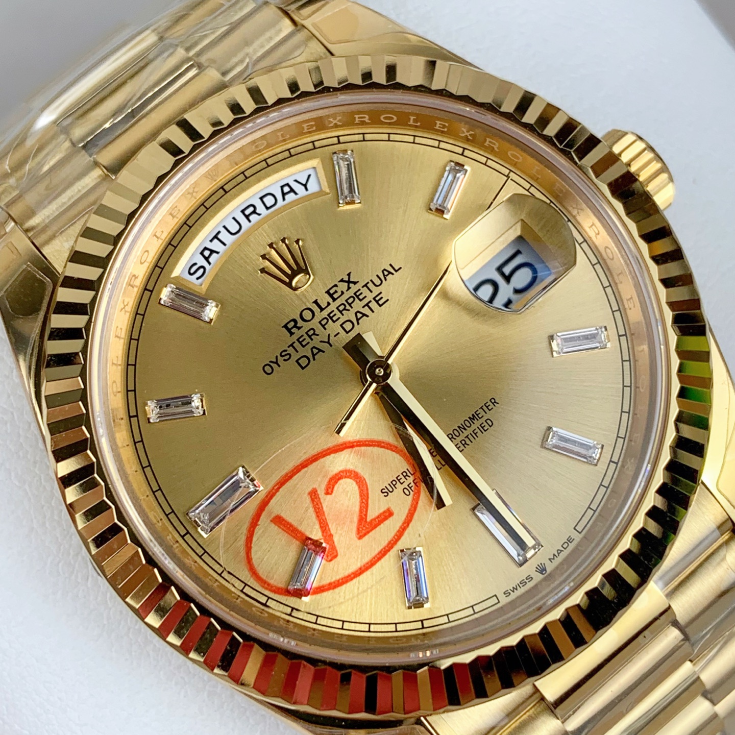 close up of fluted bezel and crown on gold day-date