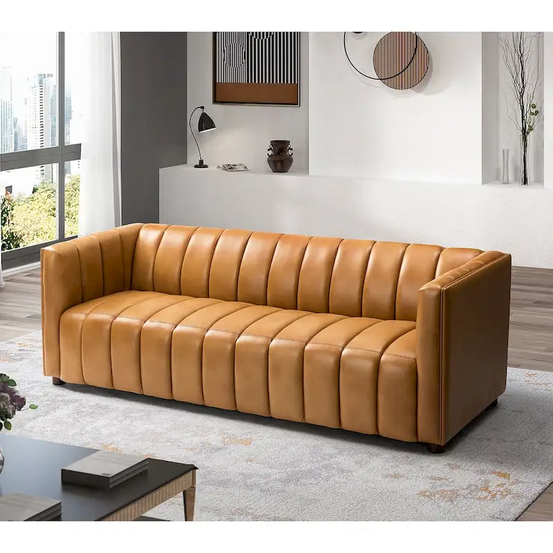 83-inch genuine leather curved sofa with a grooved backrest.