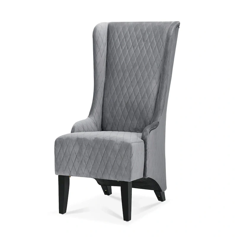 High-backed velvet wing-back chair with wooden legs