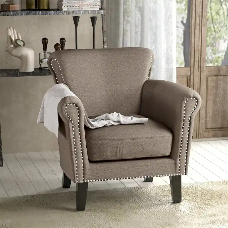 Modern roll-up club chair, adorned with rivet details