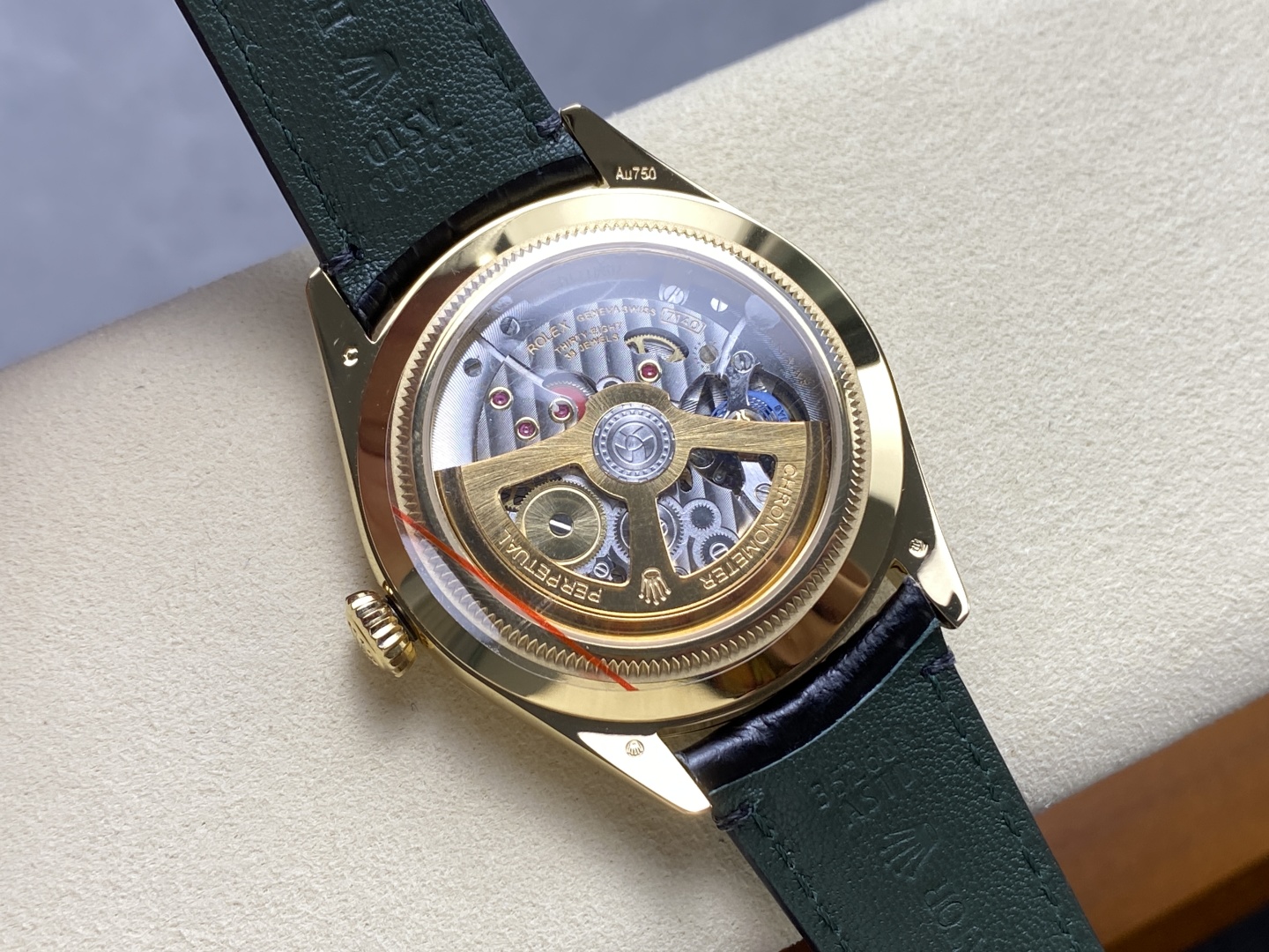 Open caseback view of a 7140 clone movement inside a gold Rolex replica watch
