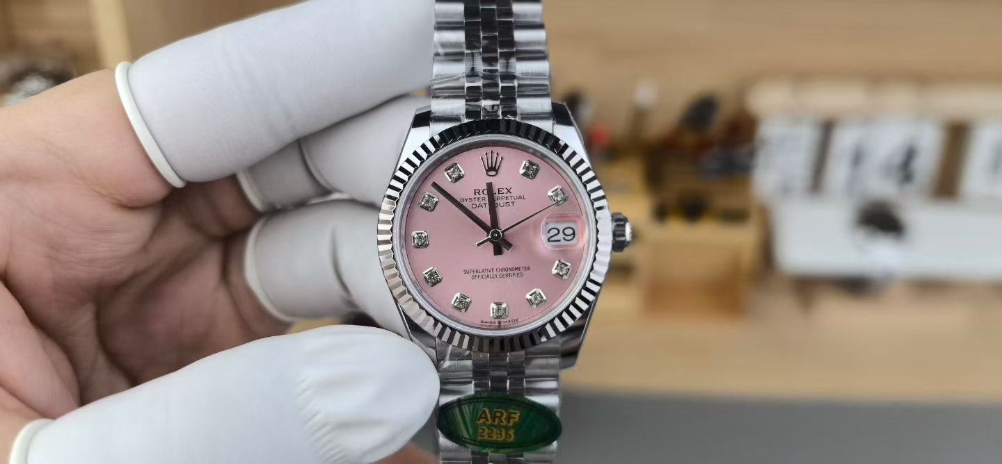 Pink dial Rolex replica Datejust front view with Jubilee bracelet and fluted bezel