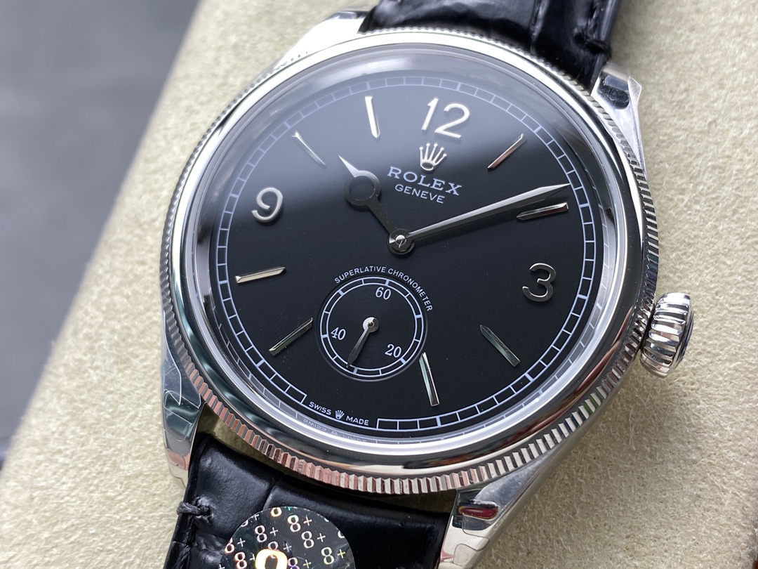 Close-up of a black dial Rolex Perpetual 1908 replica with small seconds and a fluted bezel