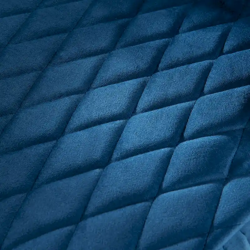 High-backed velvet wing-back chair with wooden legs