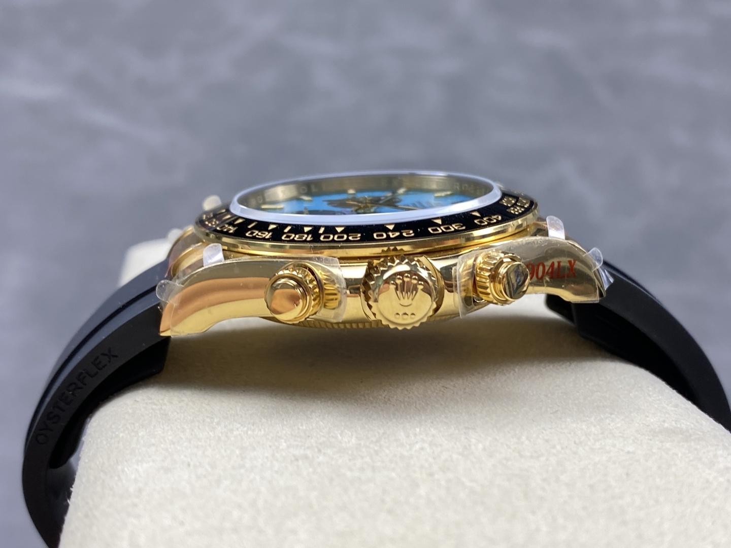 Side profile of premium replica watch with gold case, black Oysterflex strap and authentic Oyster Perpetual styling