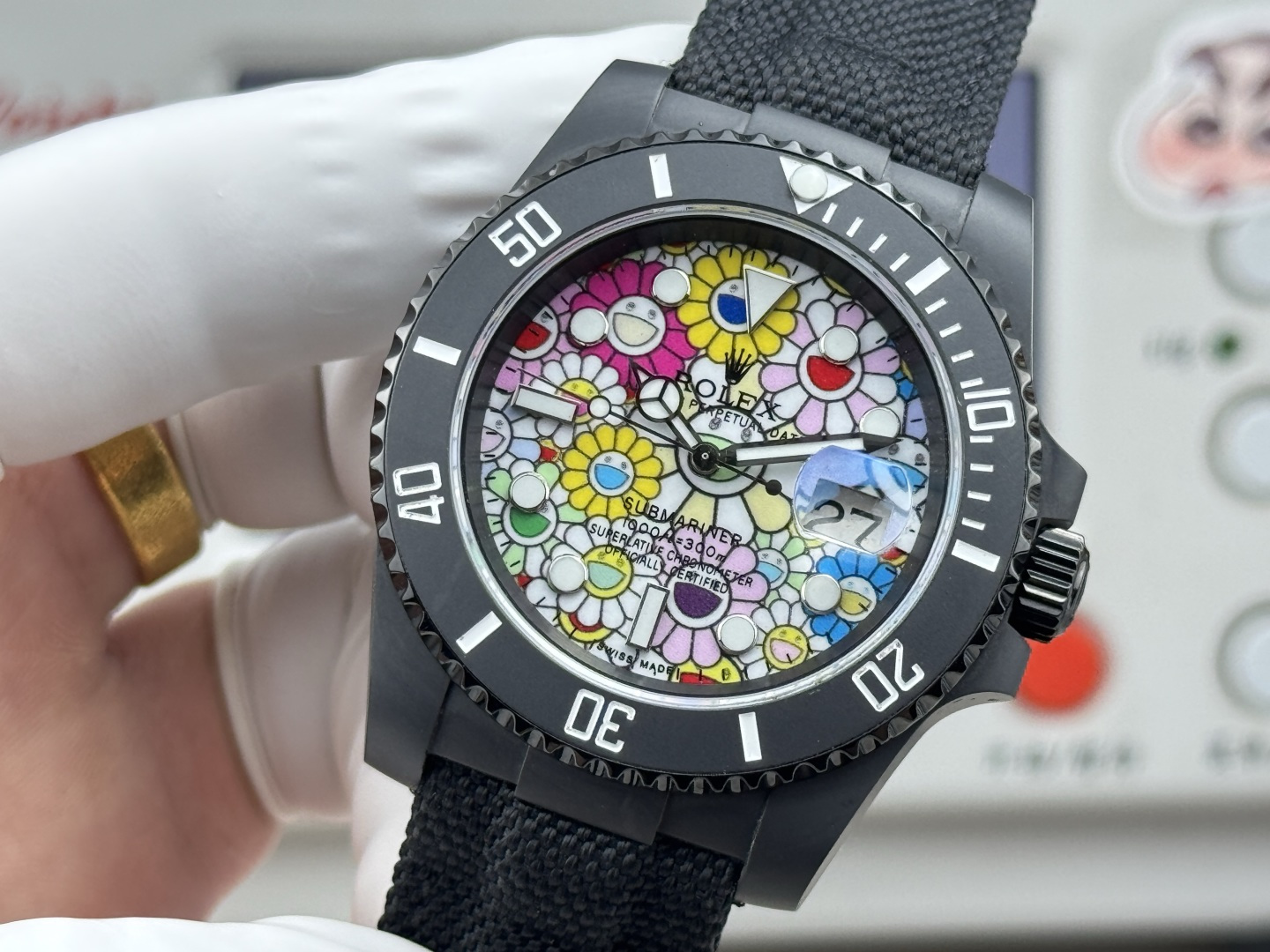 Black DLC coated replica Rolex Submariner with colorful flower dial, front view on white glove.