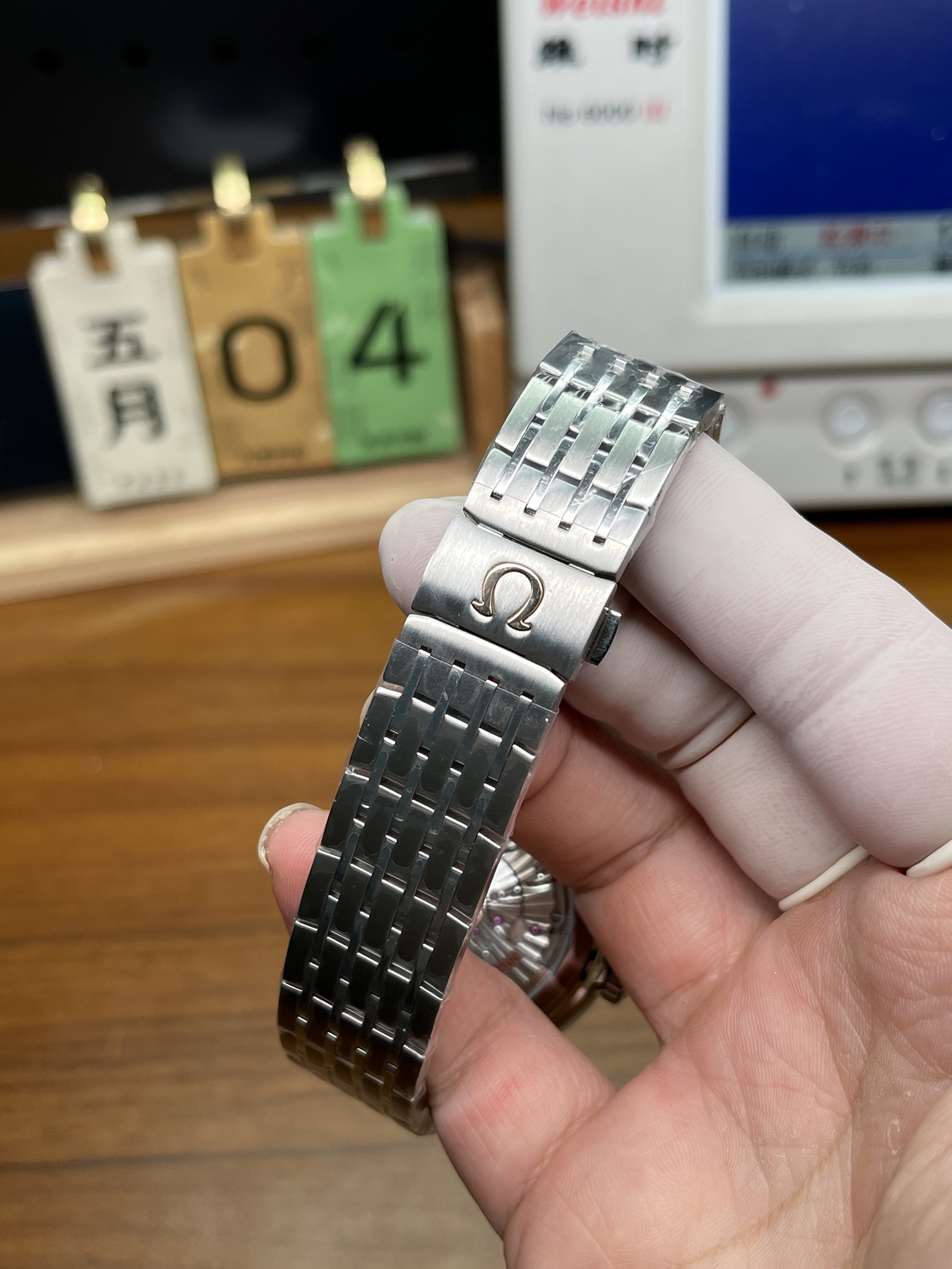 Omega replica steel bracelet clasp with engraved Omega logo