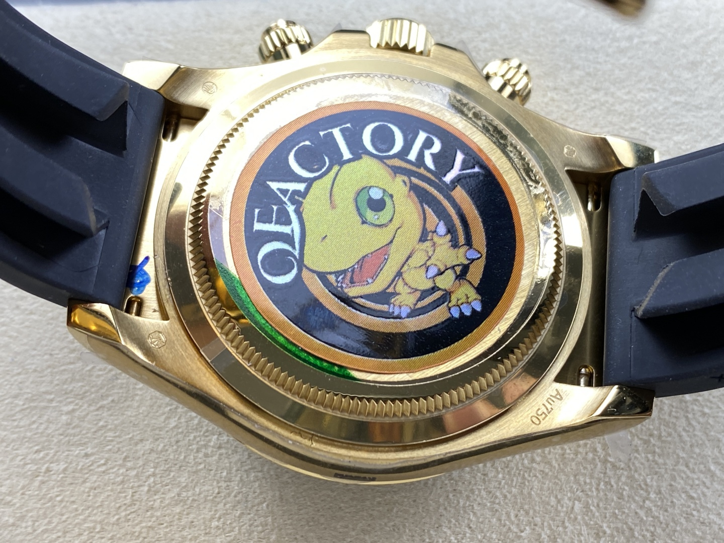 Caseback view of gold replica watch with custom engraved details and authentic construction quality