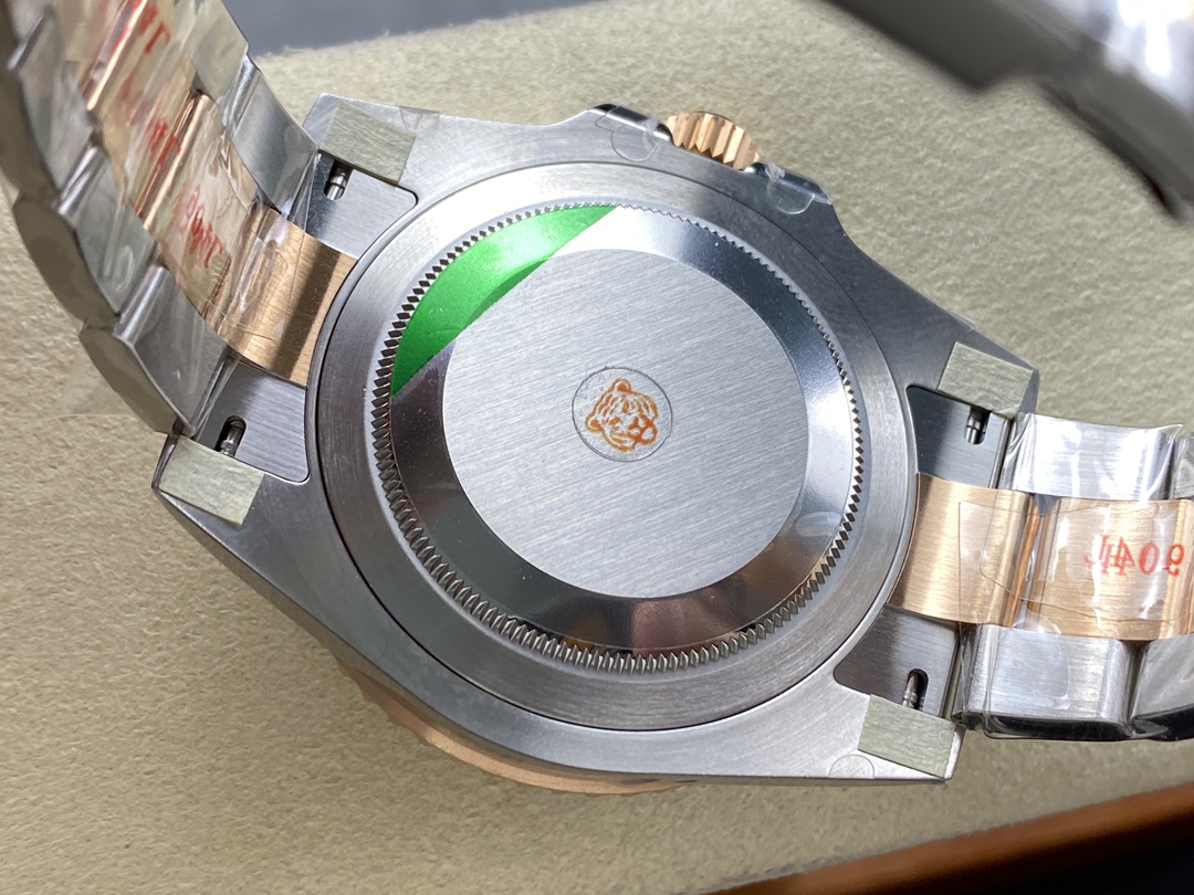 Rear view of the screw-down caseback on a luxury replica watch featuring brushed finish and distinctive tiger emblem