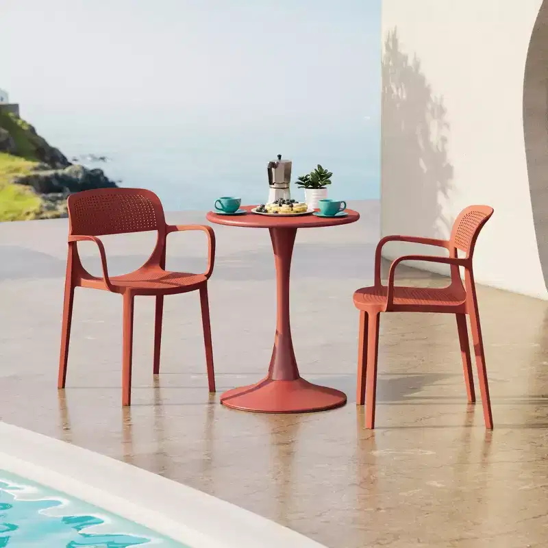 WestinTrends Playa 3-Piece Round Metal Bistro Dining Table Set And Stackable Resin Patio Dining Arm Chairs