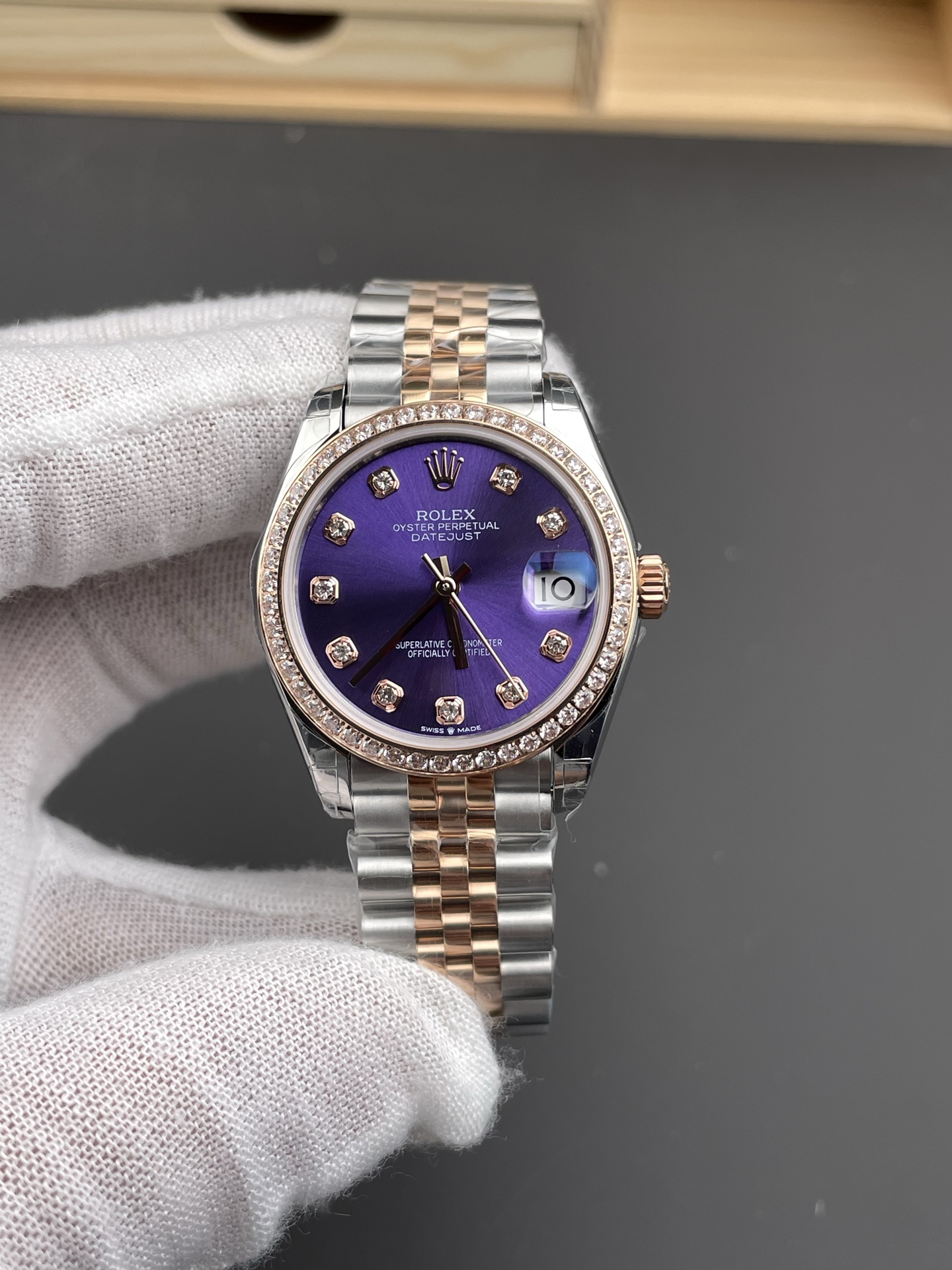 Front macro view of purple dial two tone Rolex Datejust replica with diamond bezel