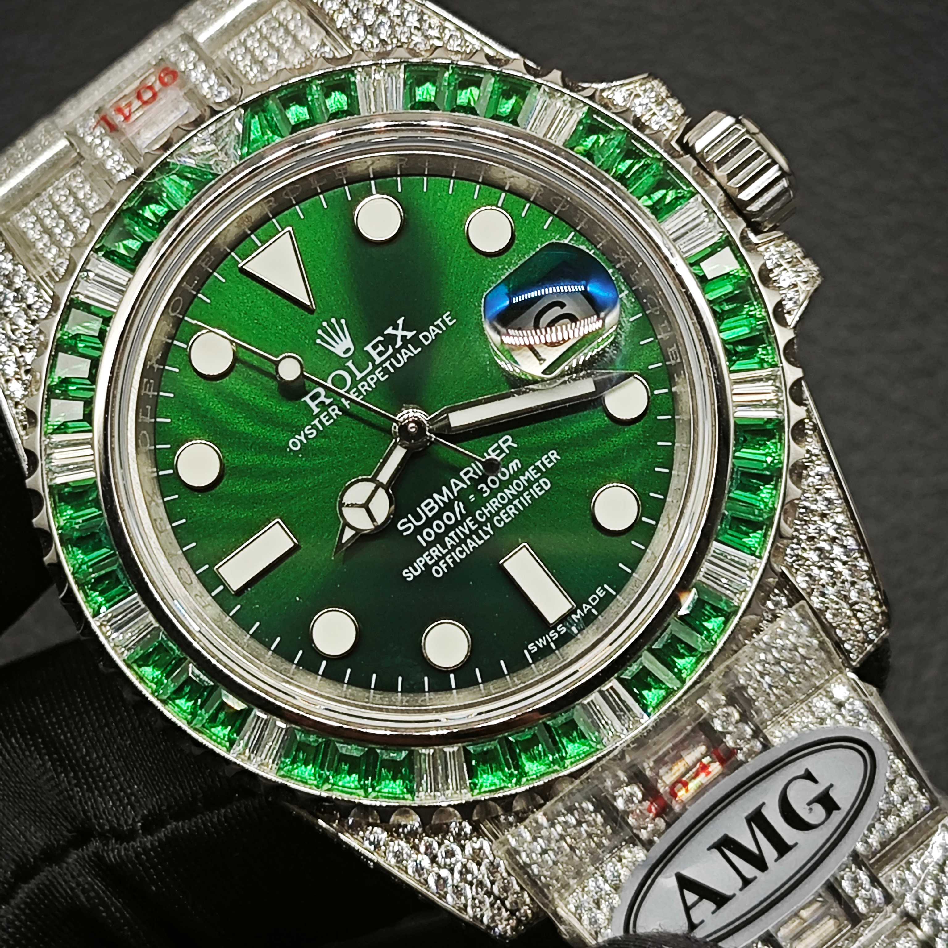 Green dial Rolex super clone close-up with emerald baguette bezel and iced case