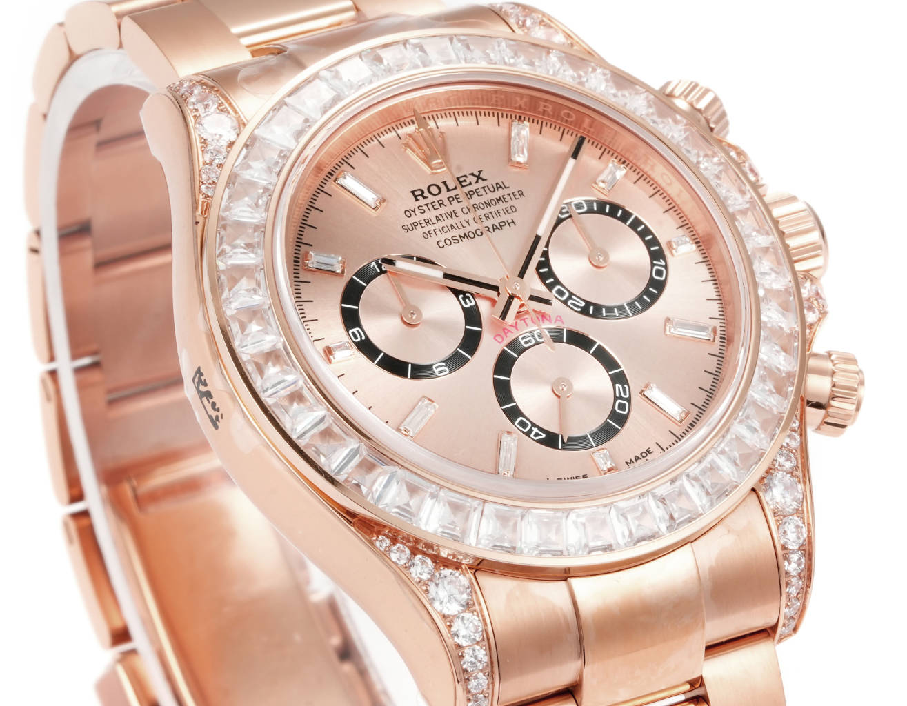 Rolex Daytona replica oro rosa con bisel de diamantes y esfera sunburst
