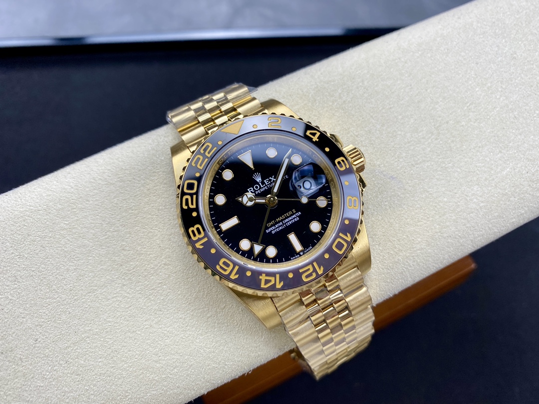 Reloj replica Rolex GMT-Master II en oro con esfera negra y bisel azul y negro