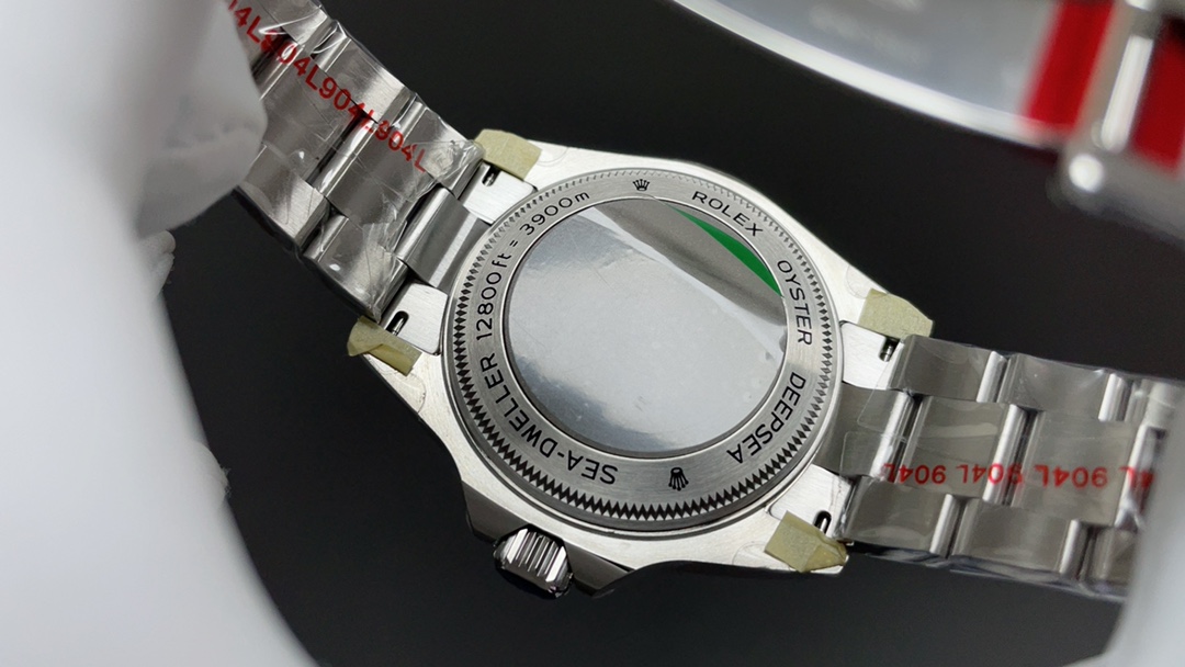 Replica Rolex Sea-Dweller caseback engraving with protective bracelet wrapping