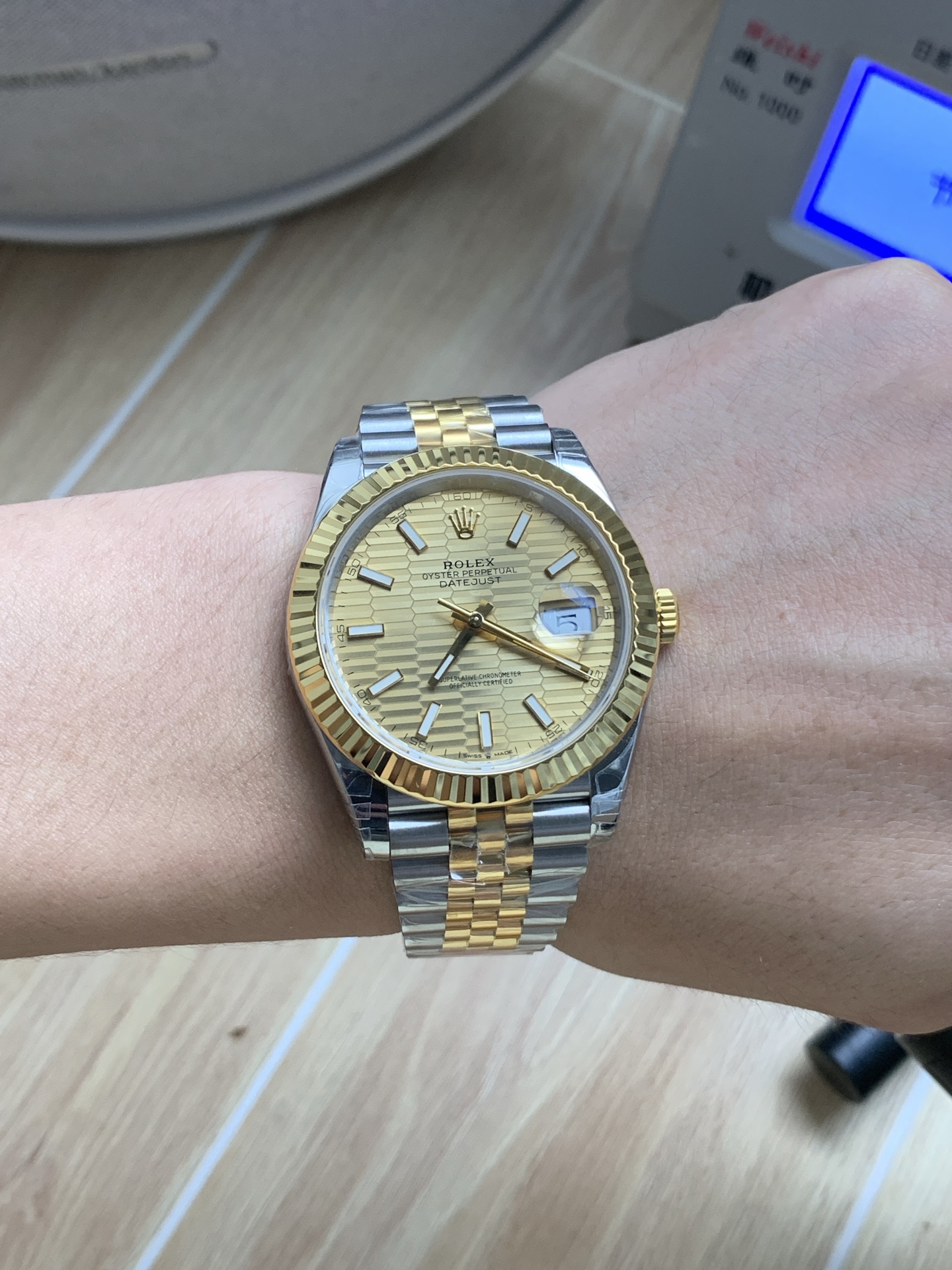 Rolex Datejust gold dial on wrist close view