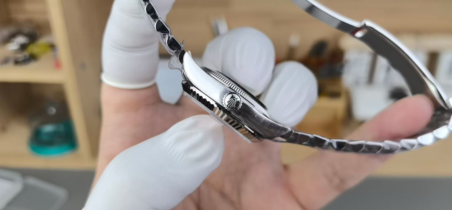 Rolex replica Datejust side profile showing crown, case thickness, and fluted bezel