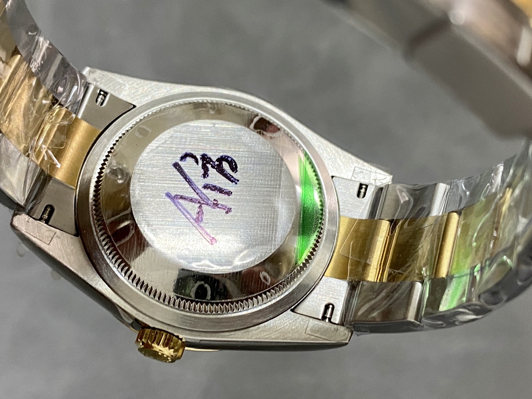 Caseback of the replica with QC sticker and handwritten markings