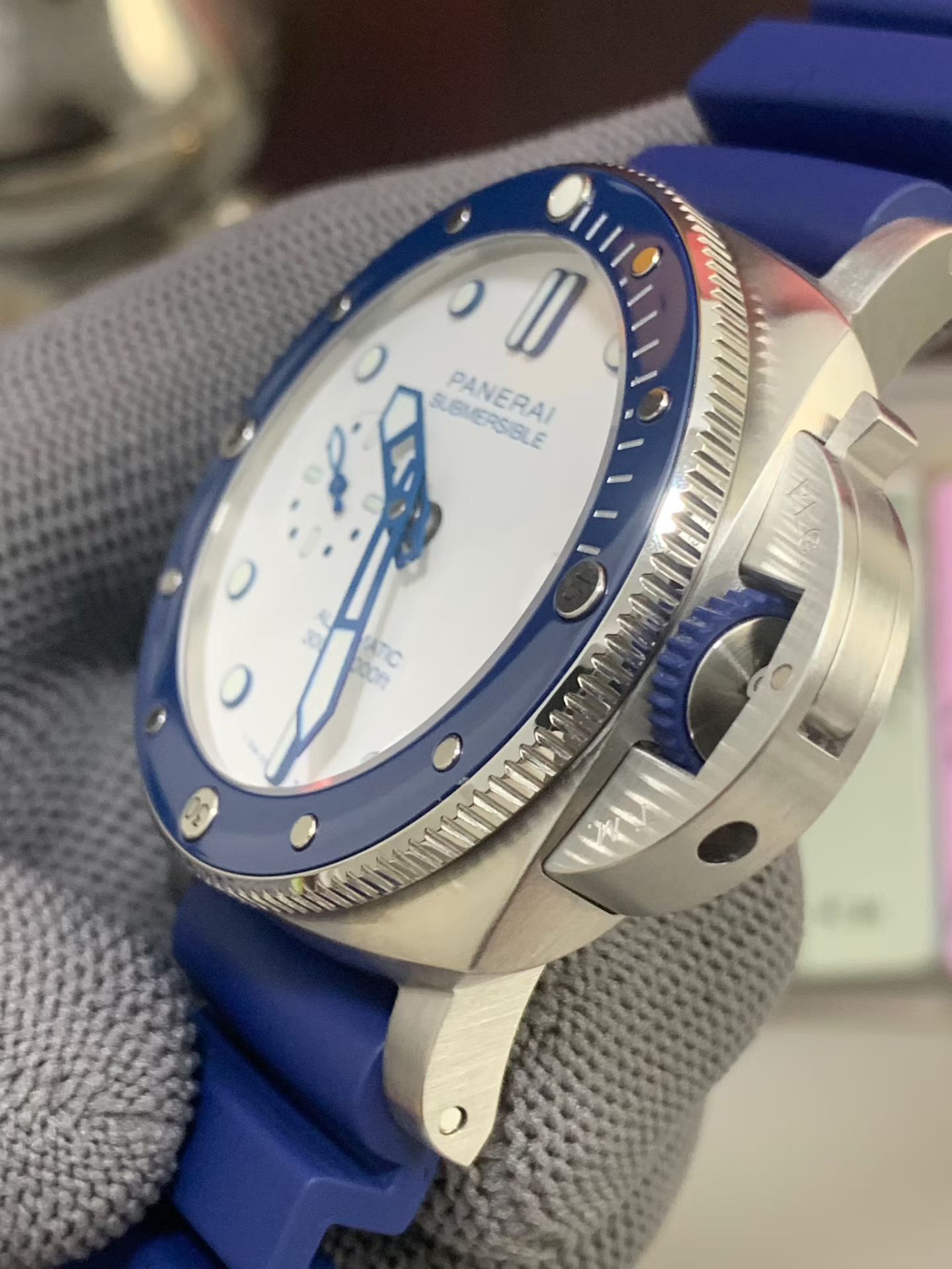 Side angle of Panerai Submersible replica watch showing blue bezel crown guard and case profile