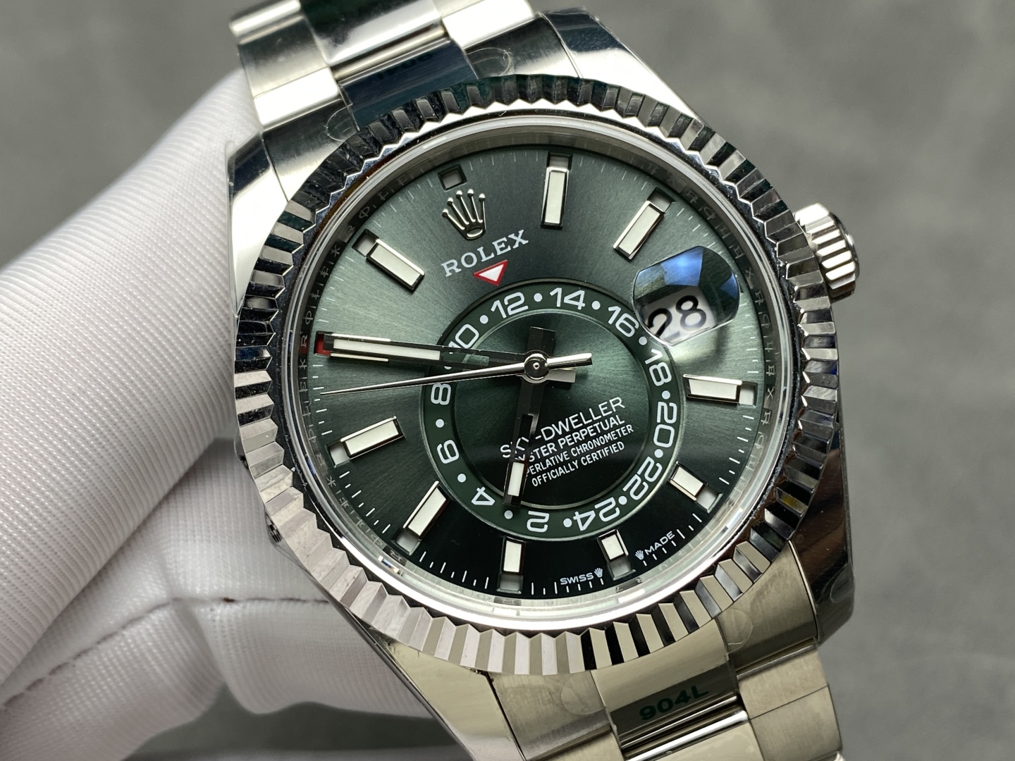 Close-up green dial Rolex Sky-Dweller replica with fluted bezel and cyclops date window