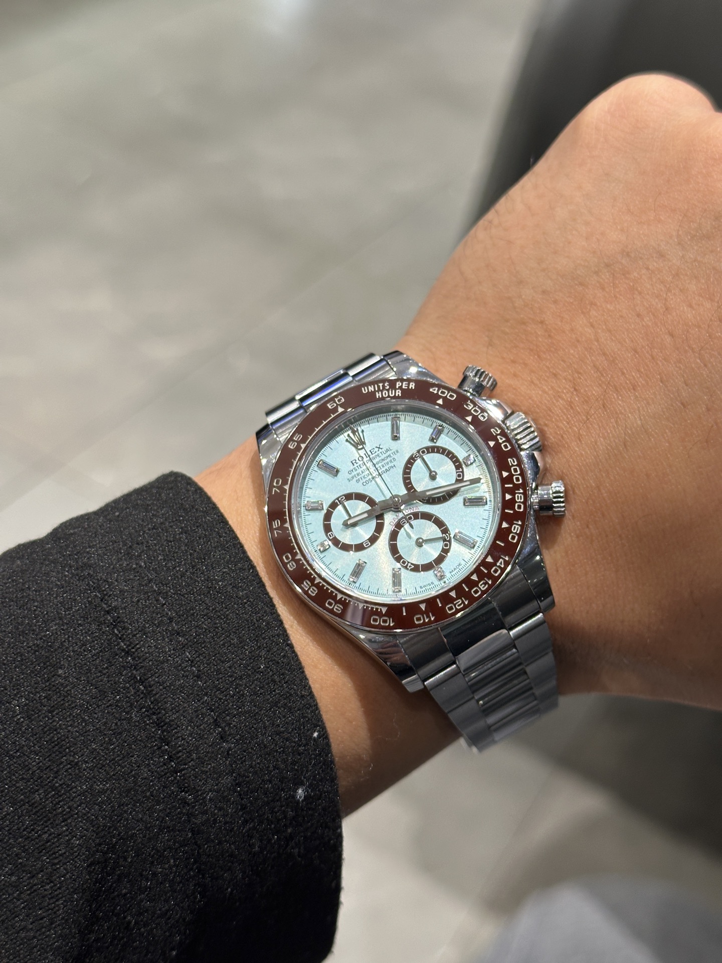 Ice blue chronograph watch photographed on the wrist in indoor lighting