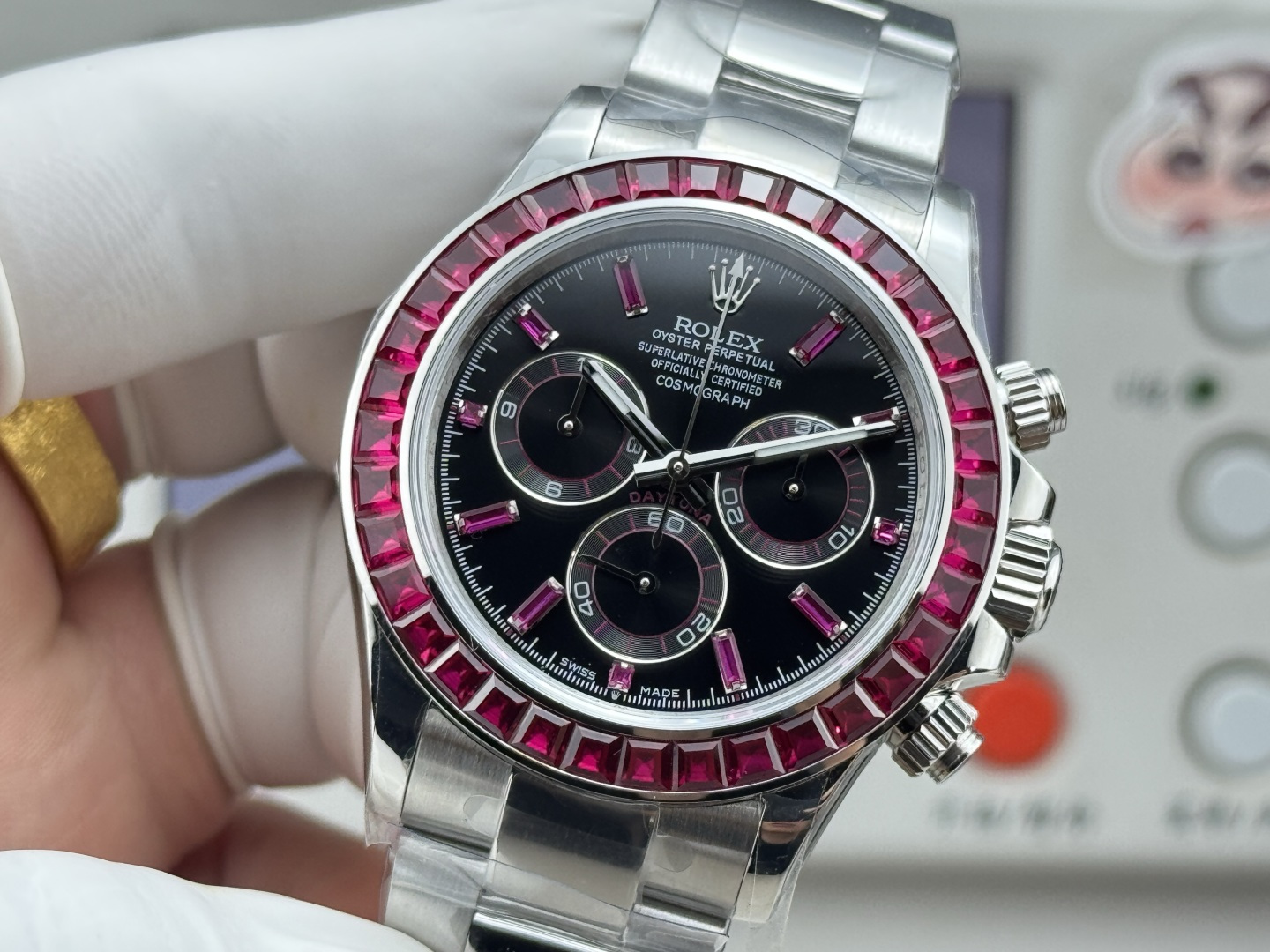 Rolex Daytona replica close front view with ruby-tone bezel and black dial details