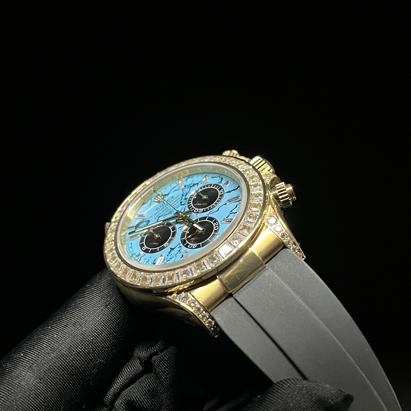 Vibrant turquoise marbled dial Rolex Cosmograph Daytona replica with diamond paved bezel and gold accents