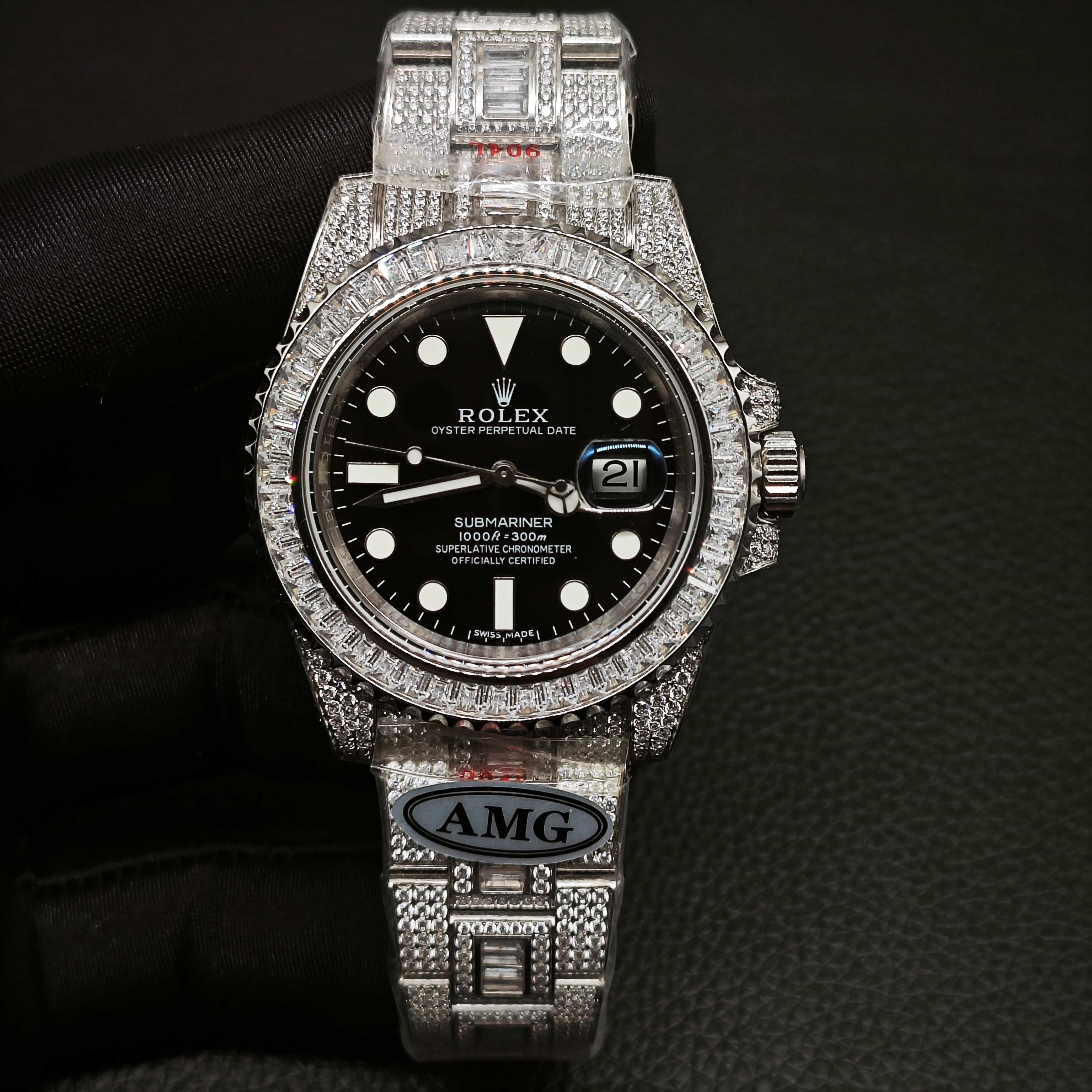 Detailed close-up of diamond-paved Rolex Submariner case and crown with blue cabochon insert
